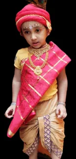 Child in traditional vibrant costume on black background wallpaper