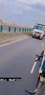 Colorful trucks driving on a highway with a cloudy sky background.