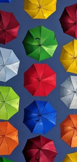 Mobile wallpaper of colorful umbrellas on a blue background.