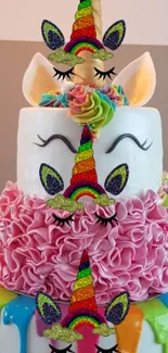 Colorful unicorn-themed cake with rainbow accents and pink ruffled frosting.