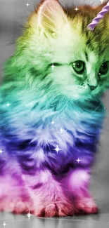 Kitten with rainbow fur and unicorn horn in a vibrant wallpaper.