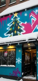 Colorful street art mural on a snowy building.