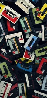 Vibrant mobile wallpaper with colorful vintage cassettes on a black background.