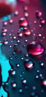 Abstract wallpaper with neon-colored water droplets on a dark surface.