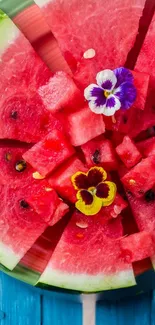 Vibrant red watermelon slice with colorful flowers on top.