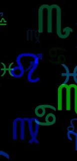 Zodiac symbols in green and blue on black background.