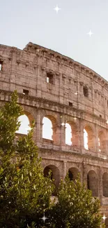 The Colosseum at sunset with sparkles and green foliage.