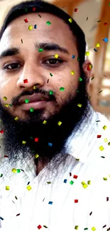 Man with beard in confetti surround, beige tone.