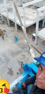 Worker taking a selfie on a construction site at high altitude.