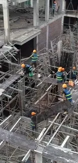 Workers on scaffolding in a construction site.