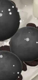 Chocolate cookies with snowflakes on a winter-themed wallpaper.