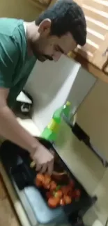 Man cooking vegetables in a cozy kitchen setting.