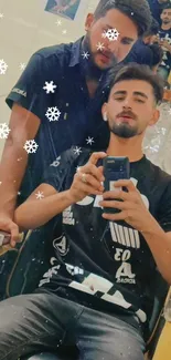 Trendy barbershop selfie with stylish outfits and snowflake filter.