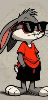 Cool cartoon bunny with sunglasses in red shirt and shorts on a gray background.