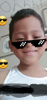 Smiling child in sunglasses with emojis on a fun wallpaper.