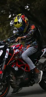 Motorbike rider on vibrant red bike in urban setting.