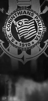 Black and white Corinthians logo emblem on wallpaper.