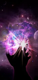 Hand reaching into a glowing galaxy with cosmic hues.