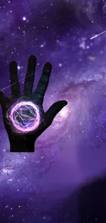 Cosmic hand against a purple galaxy backdrop.