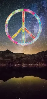 Colorful peace symbol over a starry mountain night sky.