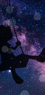 Silhouette on swing against starry night sky wallpaper.