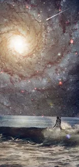 Surfer on ocean waves against a spiral galaxy in the night sky.