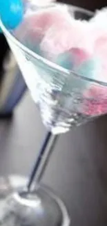 Martini glass with cotton candy decoration.