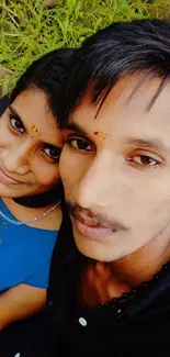 Cheerful couple posing for a selfie outdoors.