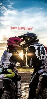Couple riding dirt bikes at sunset with love message overhead.