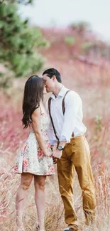 Couple embracing on a nature path in autumn hues.