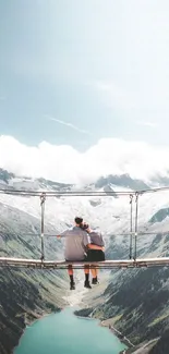 Couple on a mountain hanging bridge, serene landscape view.