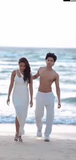 Romantic couple walking on a beach by the ocean, surrounded by serene blue waters.