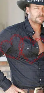 Rugged cowboy in black shirt with red heart patterns.