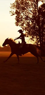 Silhouette of a cowboy riding a horse at sunset with a sepia background.