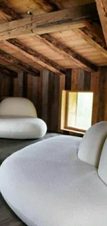 Cozy attic interior with modern white furniture and rustic wooden beams.