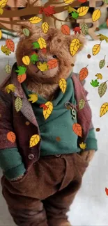 Autumn teddy bear with falling leaves wallpaper.