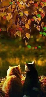 Autumn scene with two cats under golden leaves.