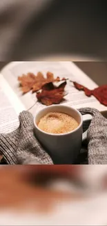 Cozy coffee with book and autumn leaves, perfect for fall vibes.