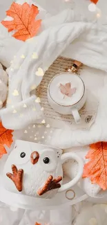 Cozy autumn scene with owl mug, leaves, and fabric textures.