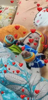 Cozy baby surrounded by floating red hearts on a colorful blanket.