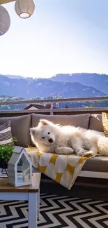 A fluffy white dog relaxing on a stylish balcony with mountain views.