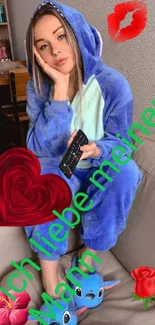 Girl in blue onesie holding remote, surrounded by playful emojis.