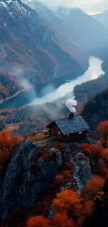 Cozy cabin perched on autumn mountain with serene lake view.