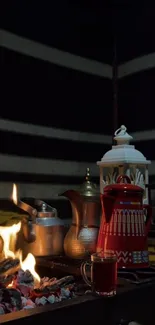 Cozy campfire scene with coffee pots and lantern light.