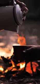 A cozy campfire scene with hand pouring coffee at dusk.