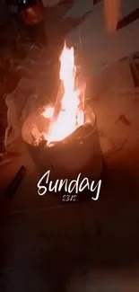 Cozy campfire with Sunday text, warm and serene.