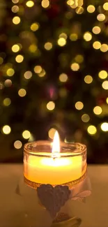 A glowing candle in front of a blurred Christmas tree with golden bokeh lights.