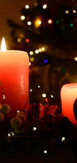 A festive wallpaper featuring glowing red candles with twinkling holiday lights.