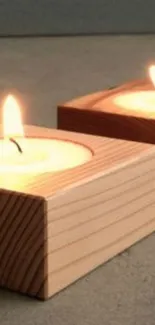 A cozy candlelight scene with wooden block candleholders.