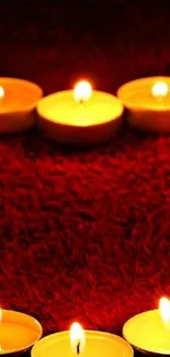 Cozy red textured background with glowing candlelight.